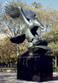 Eagle on pedestal between two ranks of four inscribed pylons (eight pylons in all; axis aligned with Statue of Liberty)