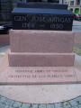 Standing figure (heroic scale), integral plinth, pedestal, plaque in rear