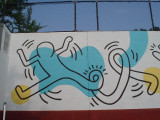 Mural on rear of concrete handball wall, facing outdoor pool