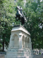 Equestrian figure (over life-size) on integral plinth on pedestal