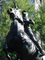 Equestrian figure (over life-size) on integral plinth on pedestal