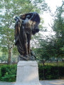 Standing male figure (heroic scale) with integral plinth on pedestal raised on three steps, tablet