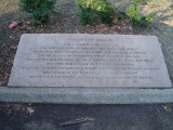 Column, plaque set in ground