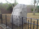 Boulder with incised inscription