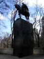 Equestrian statue (heroic scale) on pedestal with four coats of arms