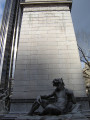 Pylon fountain embellished with colossal group, nine figures (heroic scale), and frieze; three plaques (two large, one small); four gate houses, each with a door and three low reliefs