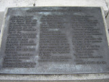 Obelisk supported by bronze crabs at four corners of base, on a block on a square terrace, plaques