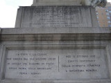 Standing figue (colossal scale) on rostral column on pedestal, base, and plinth; pedestal figure of a winged youth examining a globe; two bas-reliefs on base