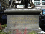 Seated figure on integral plinth (over life-size),on pedestal