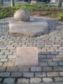 Small boulder with incised anchor motif, atop large inscribed boulder, inscribed marker