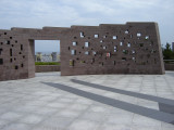 Commemorative wall with inscribed names; plaza