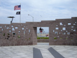 Commemorative wall with inscribed names; plaza