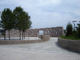 Commemorative wall with inscribed names; plaza