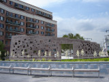 Commemorative wall with inscribed names; plaza