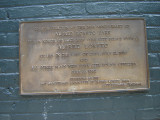 Two plaques on west side of fieldhouse