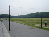 2 vertical poles on separate bases, 3 granite markers