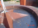 Fountain and seven section wall with 5 sections inscribed