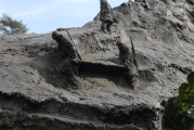 Over lifesized figure of soldier on mound, with separate mountainscape and honor-roll behind