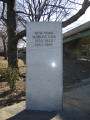 2 upright triangular stele; one has incised painted inscription