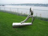 Sculpture representing casting loop on fishing poles, stands fully upright