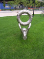 Sculpture representing casting loop on fishing poles, stands fully upright