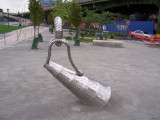 Sculpture representing casting loop on fishing pole, tilted almost to the ground