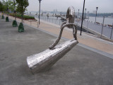 Sculpture representing casting loop on fishing pole, tilted almost to the ground