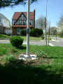 3 plaques on concrete flagstaff