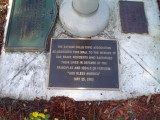 3 plaques on concrete flagstaff