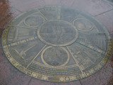 Five medallions embedded at different locations in the walkways