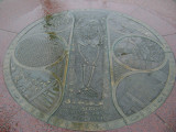 Five medallions embedded at different locations in the walkways