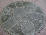 Five medallions embedded at different locations in the walkways