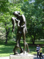 Over life-size group of two figures on pedestal