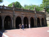 Arcaded structure with decorative ceiling panels of Minton tiles; exterior has carved limestone decorations