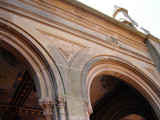 Arcaded structure with decorative ceiling panels of Minton tiles; exterior has carved limestone decorations