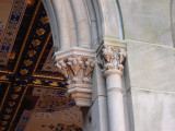 Arcaded structure with decorative ceiling panels of Minton tiles; exterior has carved limestone decorations