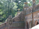 Arcaded structure with decorative ceiling panels of Minton tiles; exterior has carved limestone decorations