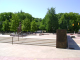 Heroic scale bronze figure, bronze fountain wall, and decorative paving and seating blocks