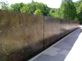 Heroic scale bronze figure, bronze fountain wall, and decorative paving and seating blocks