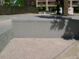 Heroic scale bronze figure, bronze fountain wall, and decorative paving and seating blocks