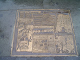 A series of 22 plaques set into the sidewalks surrounding park