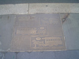 A series of 22 plaques set into the sidewalks surrounding park