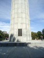 Doric column surmounted by a bronze urn, on a terrace approached by 100 steps; eagles at corners of terrace; plaque and tablet