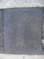 Group of three doughboy figures (over life-size) with integral plinth on a low base that rests on a circular pedestal; twenty plaques facing upward and carrying the names of the dead surround  the group