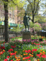 Standing figure (over life-size) with integral plinth on pedestal