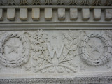 Triumphal arch, with two eagles, spandrel figures, two pier sculptures