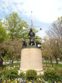 Group of two figures (life size) with eagle with integral plinth, on pedestal