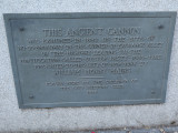 Cannon on base, plaque