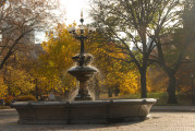 fountain with bronze and wrought iron finial on top a polychrome masonry base