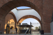 white and grey trompe l'oeil mural on archway entry of McCarren Park Pool Play Center